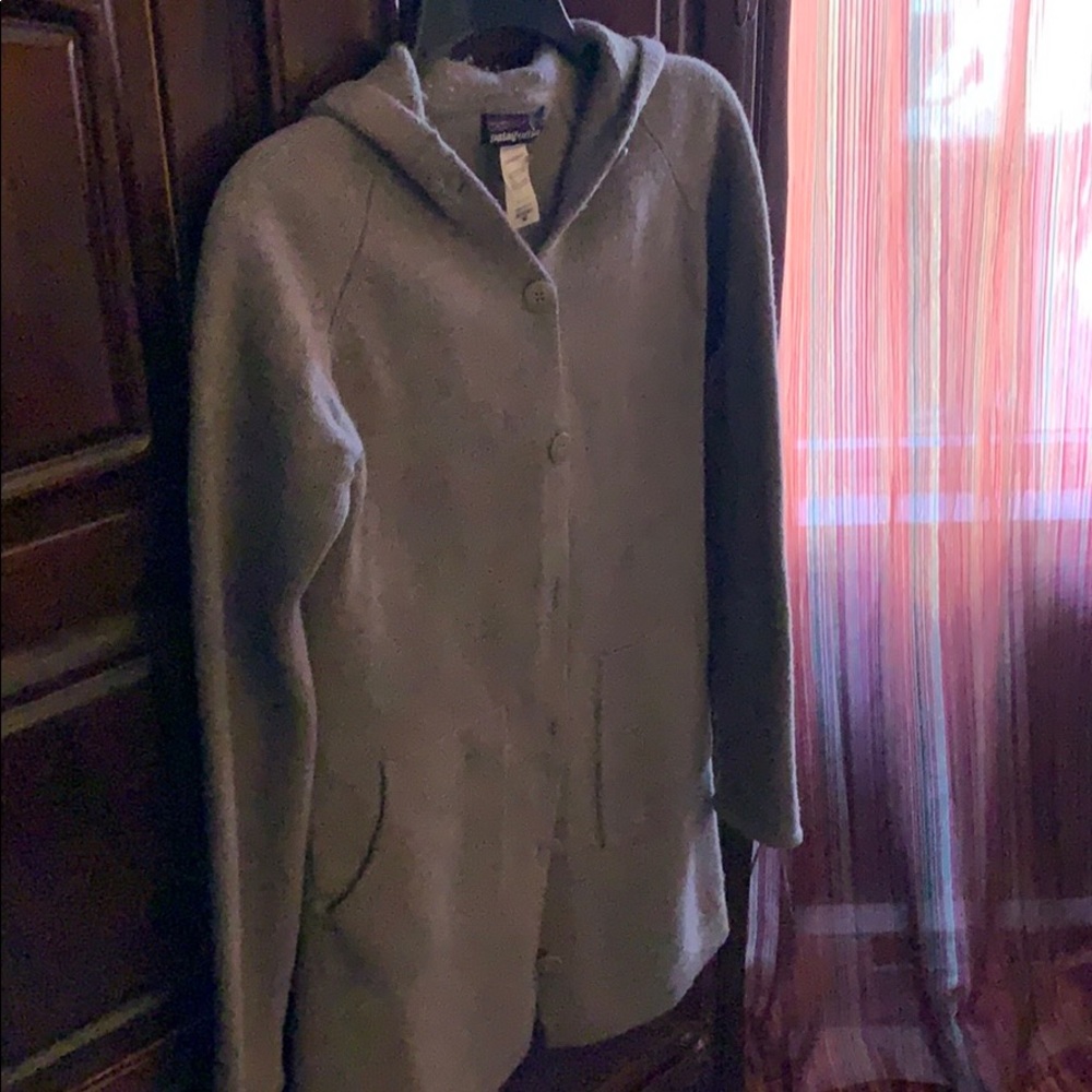Below waist Patagonia sweater.